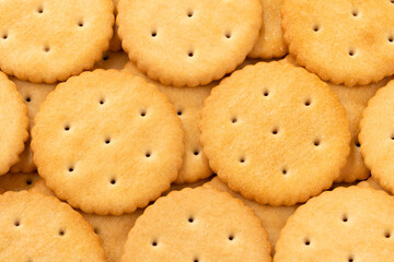 Macro shot of round salty cracker cookies. Snacks. Beer snack. 
