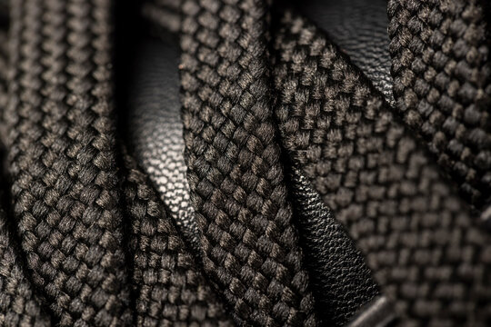 laces on leather shoes, details of the laces for black shoes, intertwined shoelaces in shoes