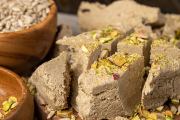 a sweet delicious dessert made from fried sunflower seeds in a wooden bowl