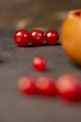 currant berries in a wooden bowl, currant berries on the kitchen table in a bowl