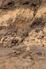 part of the excavated pits during construction work on the road, chaotic background