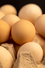 eggs in paper packaging, large chicken eggs during packaging, close up