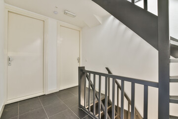 Obraz premium A sleek and minimalistic view of a modern staircase featuring clean lines and a contemporary aesthetic, ideal for showcasing interior architectural design.