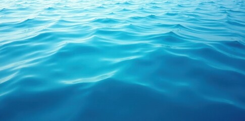Soft blue water surface with gentle wave ripples and subtle ocean swells, calming, water, ocean