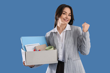 Happy fired businesswoman holding box with personal stuff on blue background
