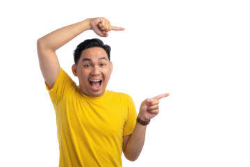 Shocked young Asian man pointing finger at empty copy space isolated on transparent background