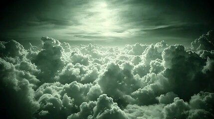 Obraz premium Aerial View of a Sea of Cumulus Clouds at Sunset Green Tinted