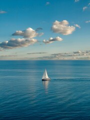 Fototapeta premium A photograph of a serene blue sea landscape with a perfectly aligned horizon