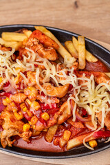 French fries with spicy chicken fajitas