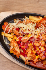 French fries with spicy chicken fajitas