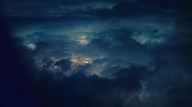 Stunning aerial views from an airplane window reveal a mesmerizing night sky filled with clouds, offering a serene beauty and unique perspectives of the world below during a nighttime flight