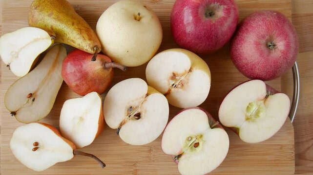 Apples and pears on the table.