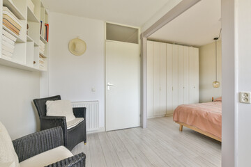 A bright, modern bedroom featuring minimal decor, a cozy bed, stylish furniture, and an inviting atmosphere ideal for relaxation.