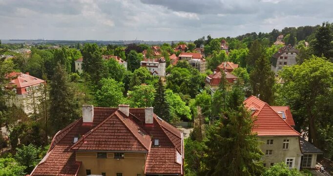 Aerial ascending shot of unique homes, sunny, summer day in Sopot city, Poland