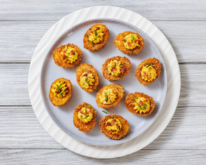 Deep fried deviled eggs with coating of panko