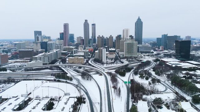 Aerial static shot of snow covered Downtown Atlanta Georgia from the Jackson Street Bridge on January 10th 2025.