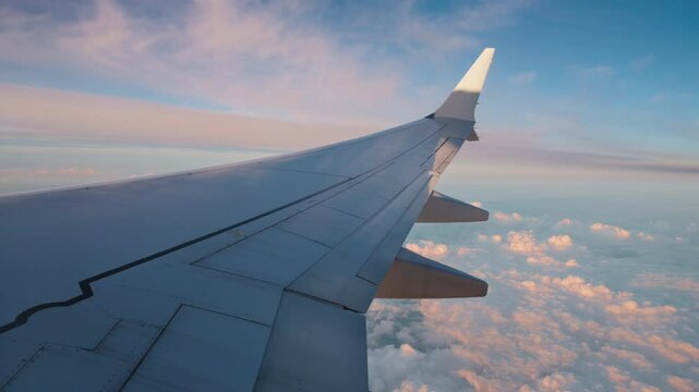 Flying high in an airplane offers breathtaking views of stunning skies and clouds, especially during unforgettable sunrises and sunsets that captivate the senses and inspire wonder and adventure