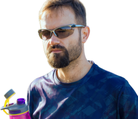 Cyclist in shorts and jersey on a modern carbon hardtail bike with an air suspension fork