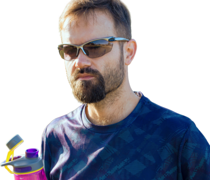 Cyclist in shorts and jersey on a modern carbon hardtail bike with an air suspension fork