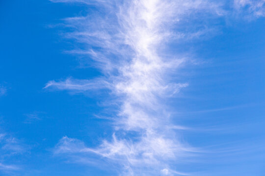 puffy soft clouds in harmonic vertical structure at sky
