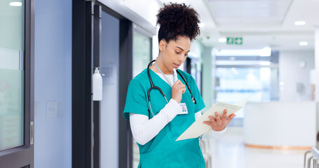 Nurse, thinking and woman with folder at hospital for patient healthcare chart, medical report and schedule solution. Medicine, african person and documents for health insurance and reading results