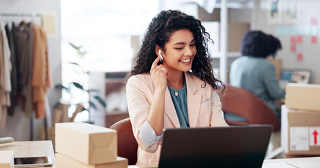Laptop, video call and woman with tech in office for ecommerce, courier or confirmation. Computer, earphones and female designer with live streaming for sale promotion with cardboard parcel.