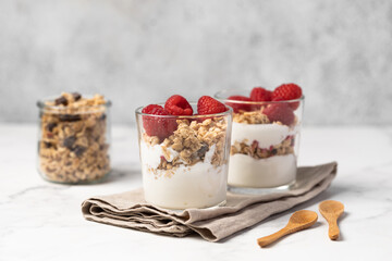 yogurt with granola and raspberries, breakfast