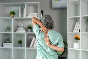 Flexibility and Active Lifestyle. An elderly woman practicing stretching exercises to enhance her flexibility and strength at home.