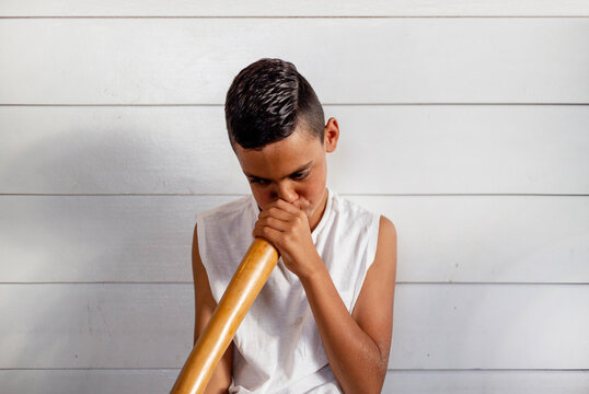 Aboriginal boy playing the didgeridoo