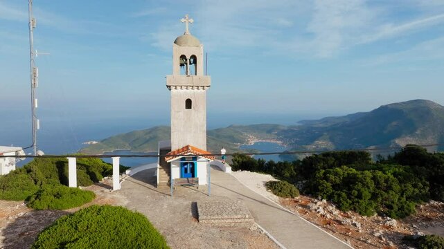 Following one man near the bell tower of Panagia Kathariotissa Monastery in Ithaca island, Greece
