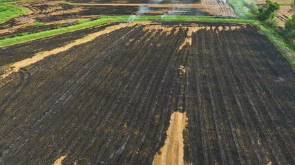 Drone shot of a farm implementing slash-and-burn techniques, showcasing the traditional but controversial method of land clearing.
