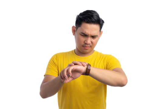 Handsome young Asian man checking time on his watch with serious facial expression isolated on transparent background