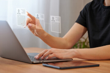 The headhunter selects a candidate based on a resume on a virtual screen. Checking and selecting a resume by the virtual interface