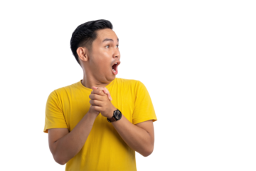 Excited young Asian man clasped hands and looking aside with surprised expression isolated on transparent background