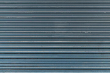 abstract background of an old dirty decorative wooden panel painted blue close up