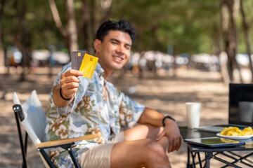 Happy Asian man travel nature the sea on summer beach holiday vacation. Portrait of Handsome guy in...