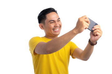 Excited young Asian man using smartphone for playing mobile game with happy expression isolated on transparent background