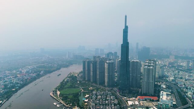 Zoomed-out drone shot of the Landmark 81 supertall skyscraper during the day in Ho Chi Minh City, Vietnam