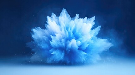 Abstract explosion of powder, blue and white hues.  A dynamic, artistic display of a cloud-like powder burst, with soft gradients, against a dark background