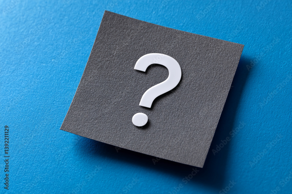 Poster gray square card on blue background, featuring a white question mark, suggesting inquiry, doubt, or 