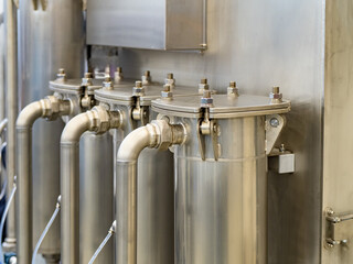 Filtration of industrial water when washing products. Metal containers for purifying liquids from...