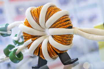 Electric transformer. Power equipment made of copper wire. Round electrical transformer close-up....