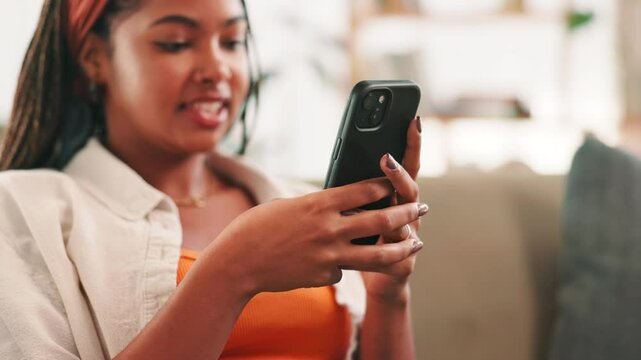 Hands, phone and texting on couch in home, contact or relax with scroll on web chat in living room. Black woman, smartphone and click on mobile app for notification, happy or social network in house