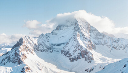 Majestic snow-covered mountain peak under a bright blue sky  