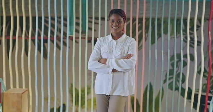 African happy young adult gen z proud ceo women intern lady cross arms look camera indoor office place. boss girl expert staff leader fold hands staring cam do casual pose at work job day time