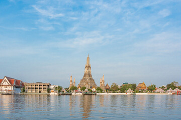 Beautiful of Buddhist temple or Wat Arun Ratchawararam Ratchawaramahawihan with famous tourist landmark sunlight in the morning, Bangkok, Thailand.