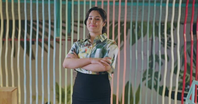 Afghan happy diverse proud gen z business women boss girl leader cross arms look camera indoor work place smiling young adult female staring cam do pose fold hand job office