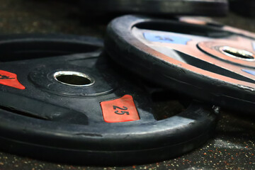 A close-up shot of two dumb plates with their flat surfaces and rounded edges.