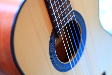 A close-up shot of a guitar's strings, ideal for music-related concepts and products.