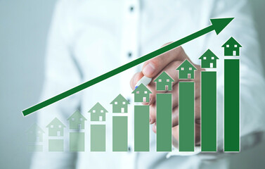 Real Estate Investment. Rising graph with a houses